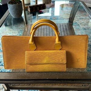 Louis Vuitton Epi Sac Triangle Tassil Purse yellow with matching wallet.